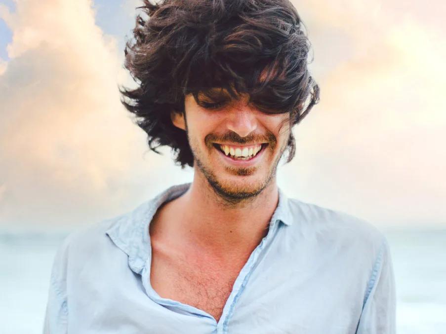 A man with windswept hair